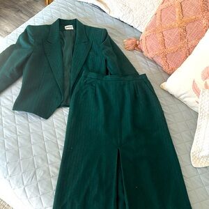 Size 10/12 Dark Green Wool Satin lined Pinstriped suit with vintage label.